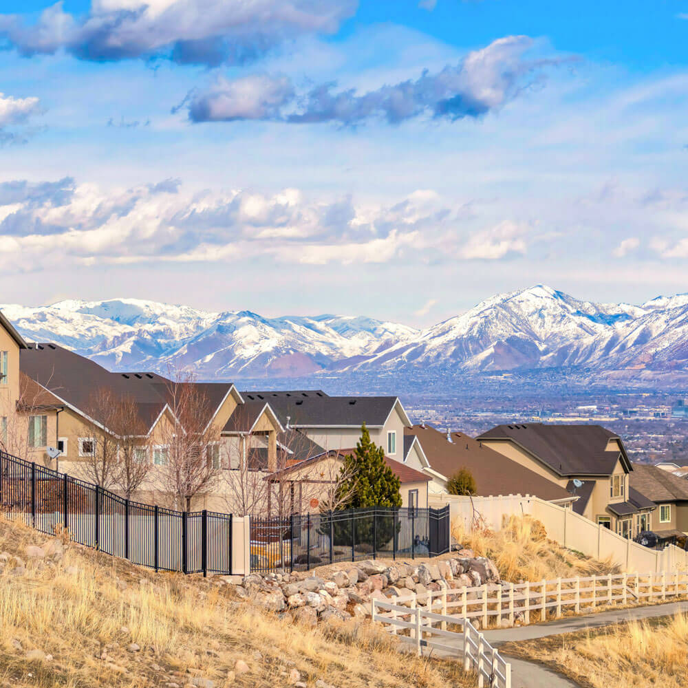 Row of houses overlooking a mountain view.